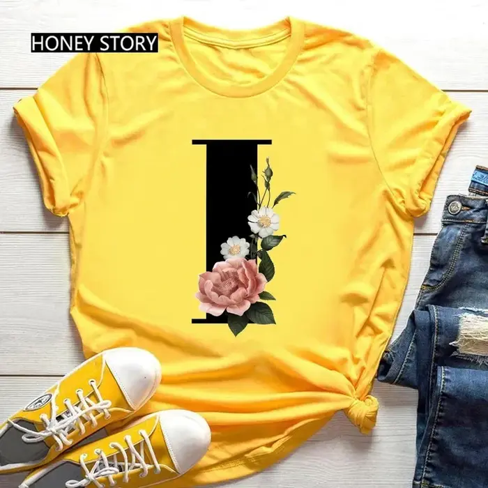 T-shirt jaune grande taille pour hommes et femmes avec imprimé tendance noir de fleurs et 26 lettres anglaises