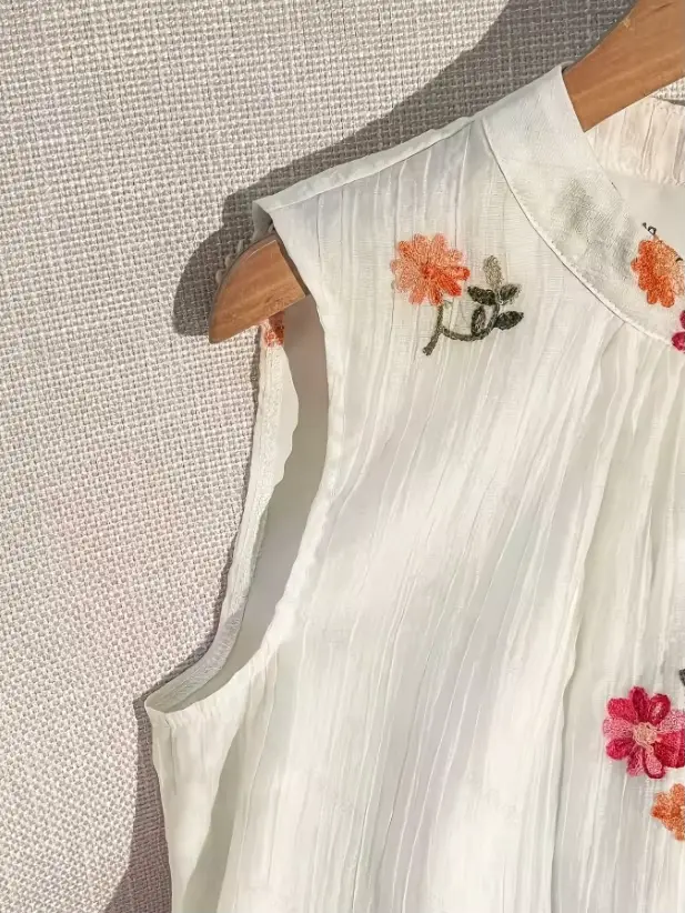 Nouvelle Blouse d'été sans manches à col rond brodée pour femme