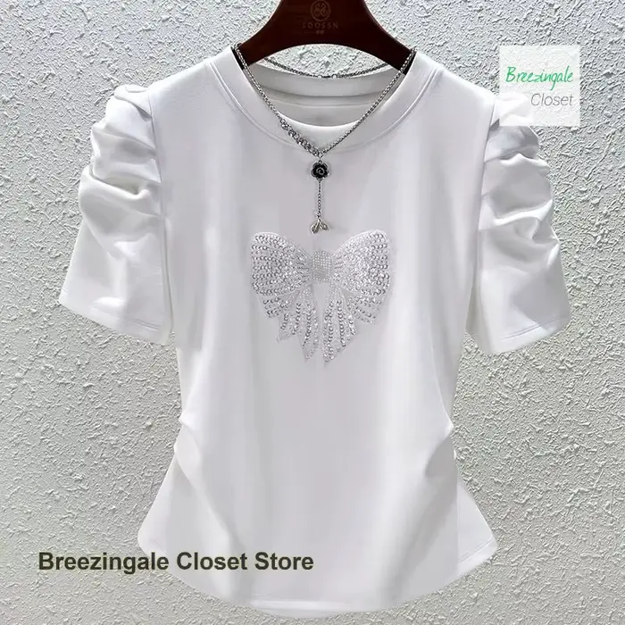 T-shirt à manches bulles avec nœud à la mode française pour femmes, nouveau design de tempérament d'