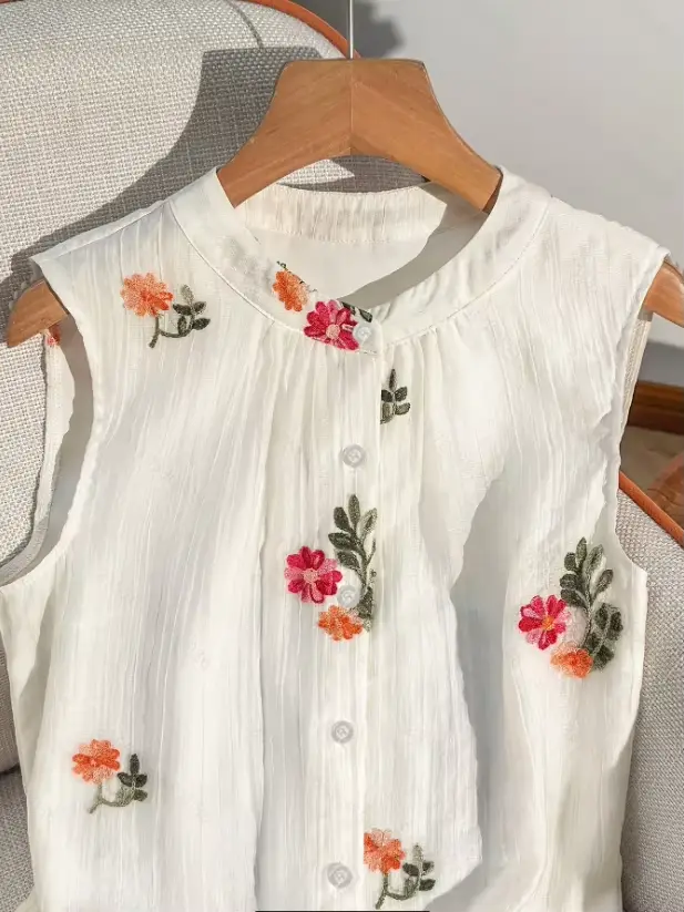 Nouvelle Blouse d'été sans manches à col rond brodée pour femme