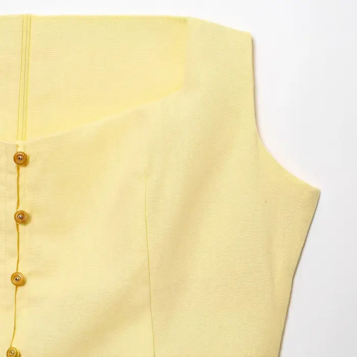 Robe longue élégante sans manches en lin uni à bouton unique