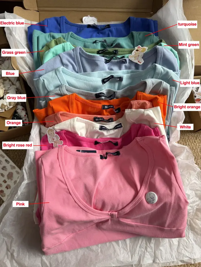 Nouveaux T-shirts roses à col en V pour femme