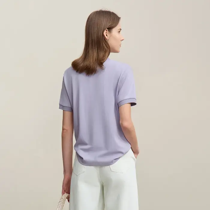 Polo Amii pour femme – Collection été 2026 – T-shirt décontracté à col revers et manches courtes avec patte de boutonnage asymétrique – Idéal pour superposer – Référence 12622015