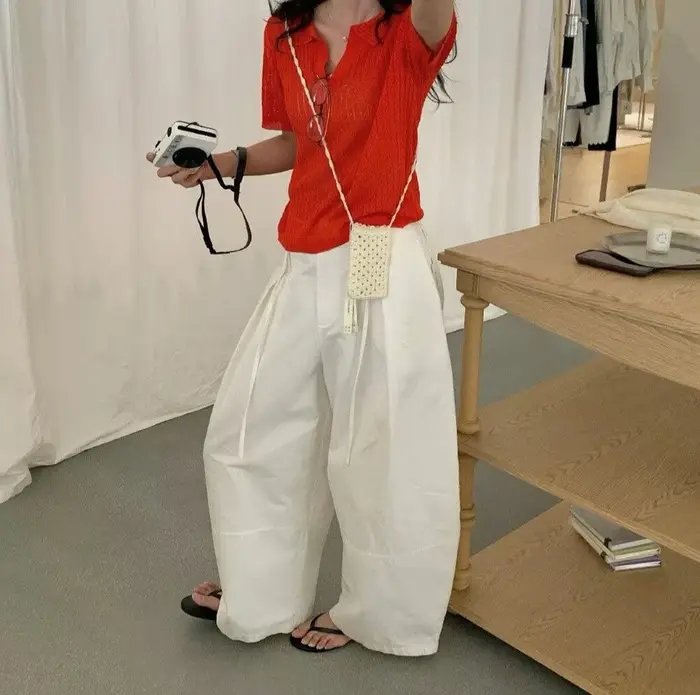 Haut slim à col polo en maille torsadée pour femme