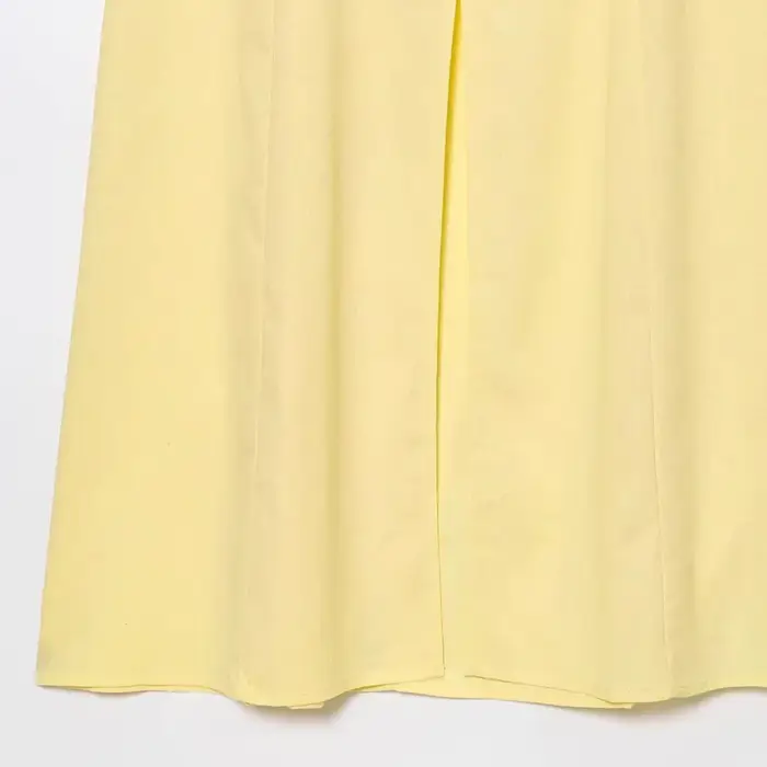 Robe longue élégante sans manches en lin uni à bouton unique