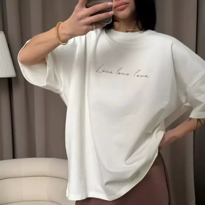 T-shirt ample pour femme à manches courtes, épaules tombantes, col rond, couleur unie, ourlet droit,