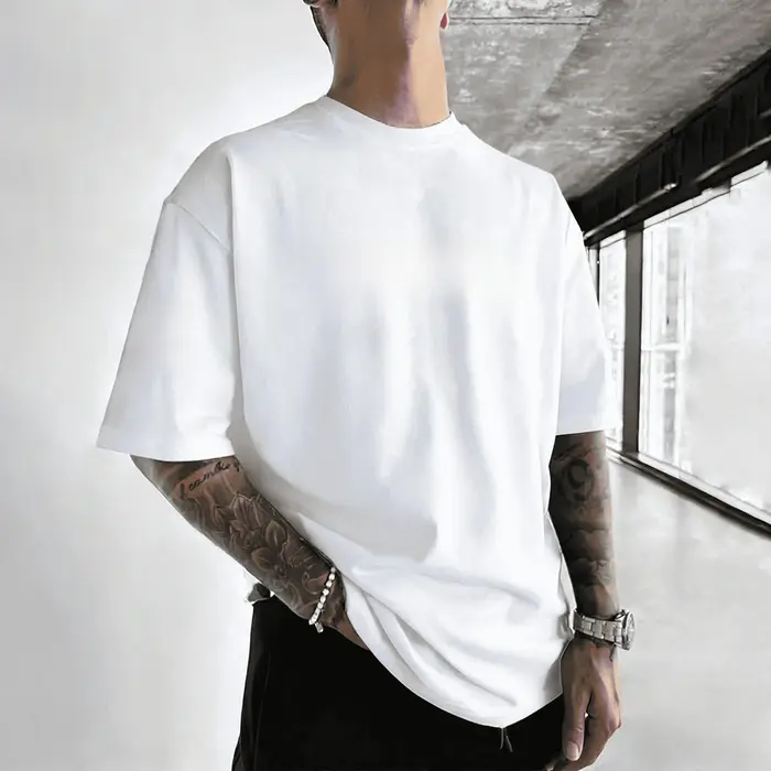 T-shirt en coton respirant uni pour homme, collection Printemps-Été 2026, style américain, coupe ample et tendance, idéal pour le sport et les trajets quotidiens