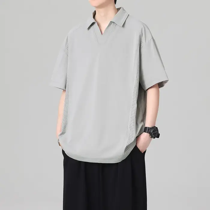 Polo pour homme à col cranté avec empiècements en maille, manches courtes, coupe ample, couleur unie