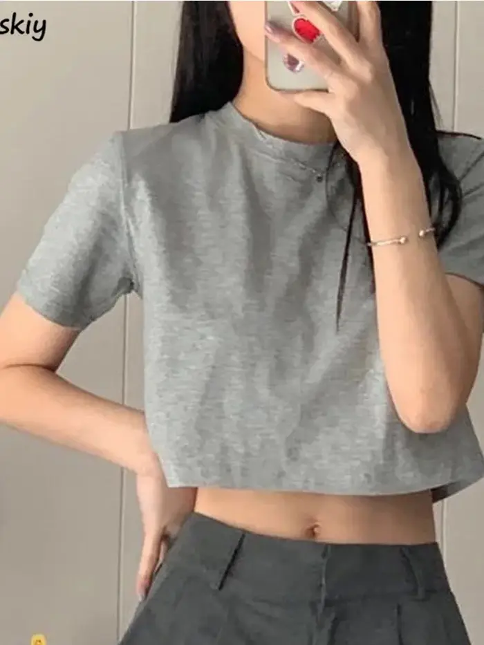 T-shirt femmes recadrée solide Sexy minimaliste offre spéciale mince décontracté mode Preppy Chic Tops basiques Style coréen Streetwear populaire