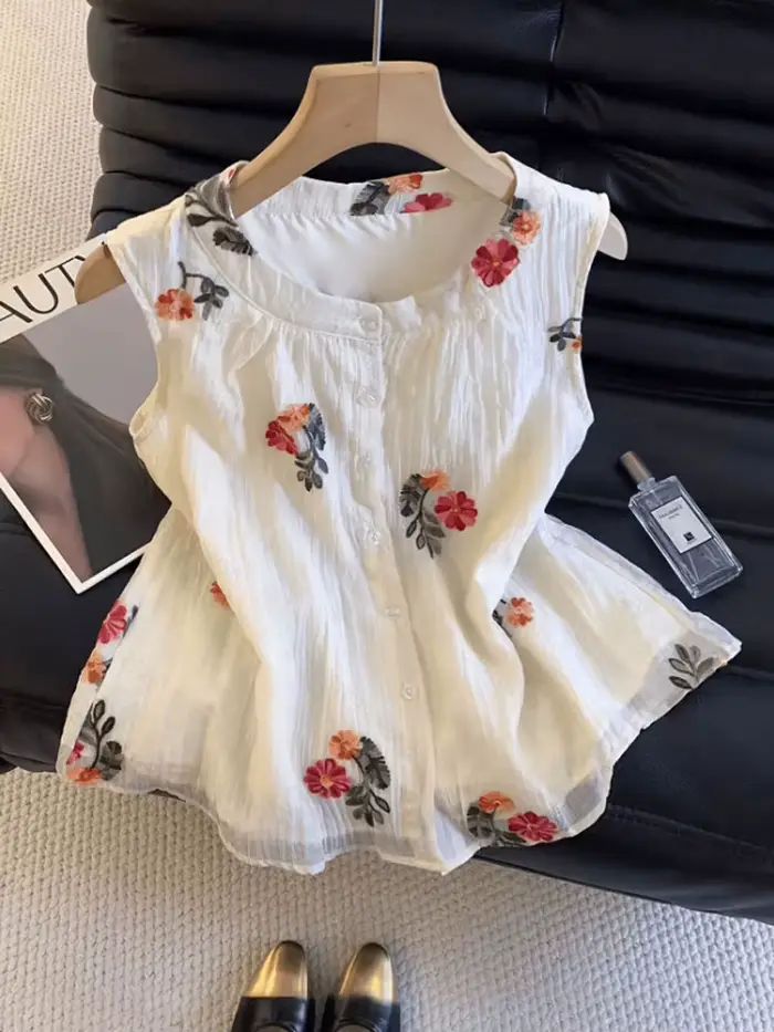Nouvelle Blouse d'été sans manches à col rond brodée pour femme