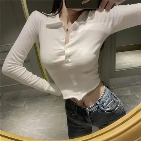 Polo uni pour femme avec bouton bleu